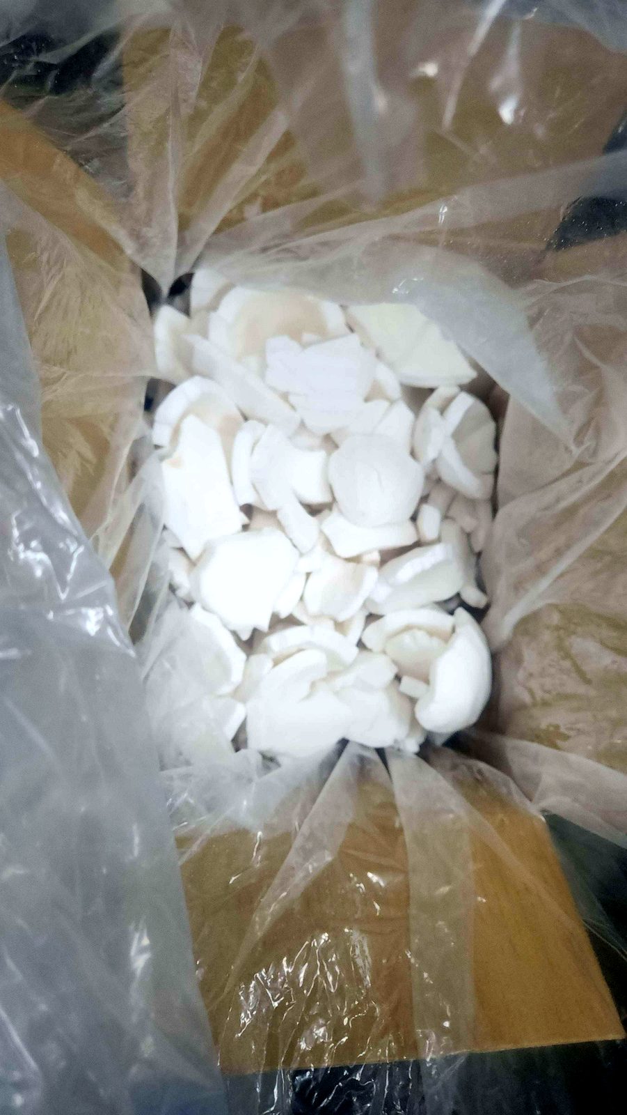 Container of white coconut slices